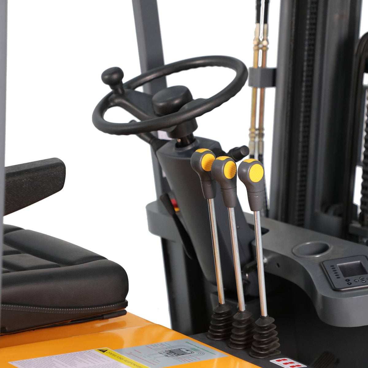 Electric forklift control levers and steering column beside the black operator seat