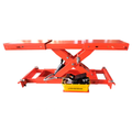 Red rolling scissor jack with black pump unit and yellow base
