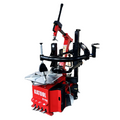 Red and black tire changer machine with tilt arm, wheel clamp, and mounting tower