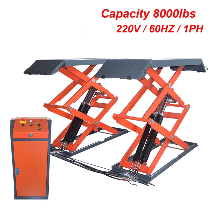 In-ground scissor lift with orange arms, black power unit and textured steel platforms