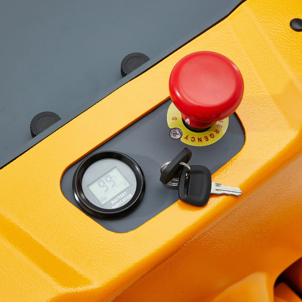 Electric pallet jack key switch and red emergency stop on yellow control panel