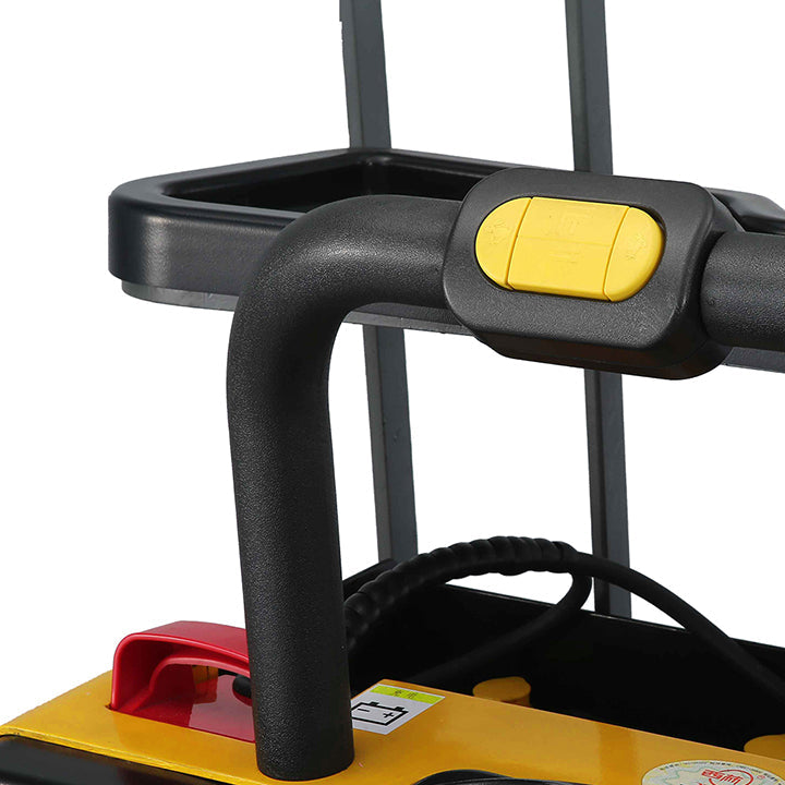 Electric pallet jack close-up of black steering handle with yellow button and red cover
