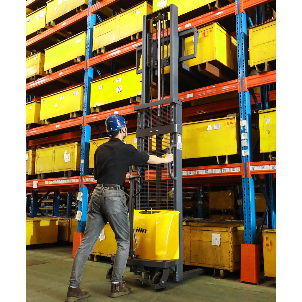 Semi-electric pallet stacker with tall mast and forks, operated by a worker in storage area