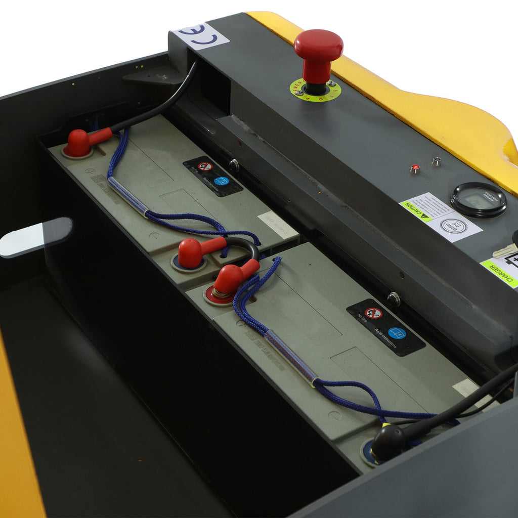 Electric stacker control compartment with red buttons and blue wiring