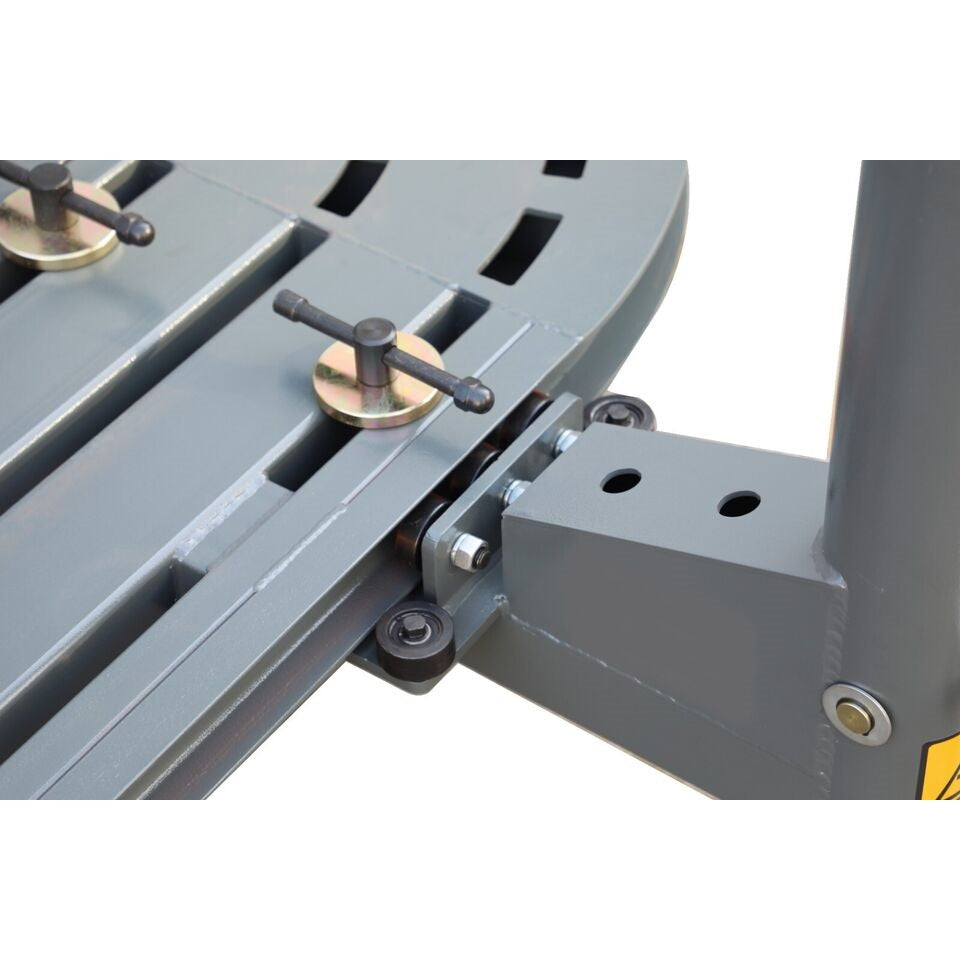 Auto body frame machine guide with metal lever, pins, and mounted plate on track
