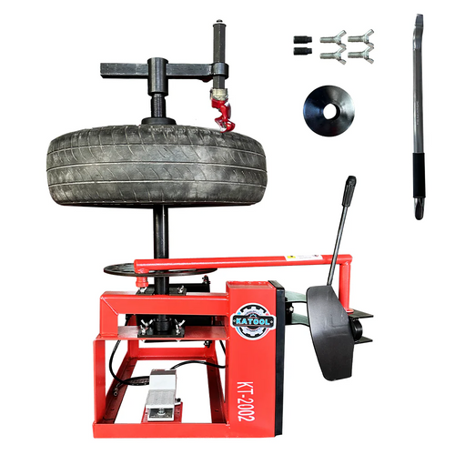 Manual tire changer with red base, tire stand, and mounted bead-breaking arm
