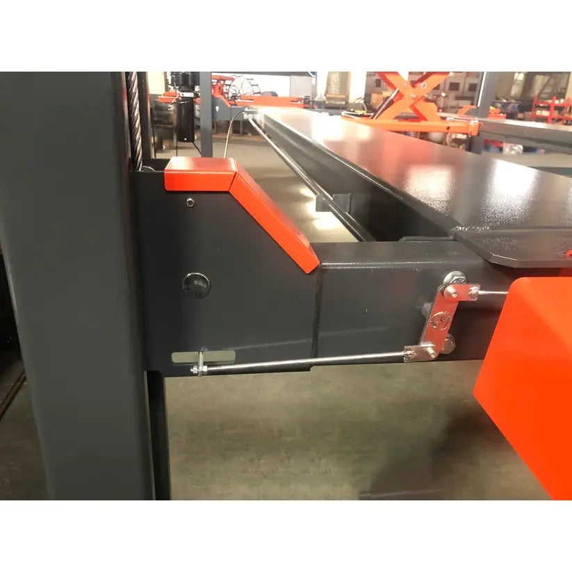4-post vehicle lift frame with orange control panel and steel safety bar near platform