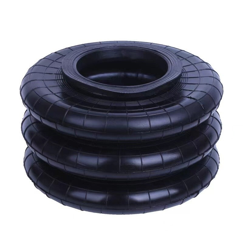 Stacked black air lifting bags with central valve opening