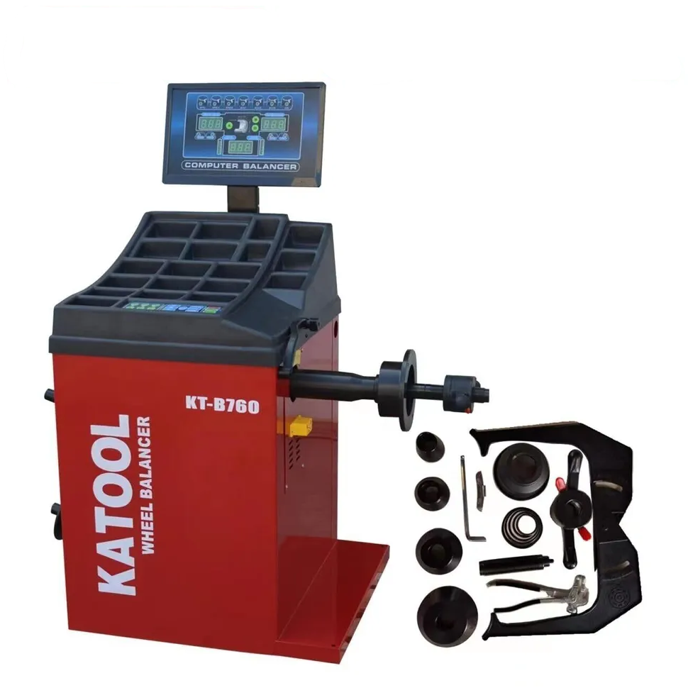Red wheel balancer with monitor and mounted axle, with balancing accessory assortment.