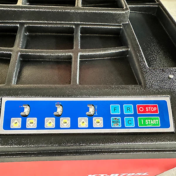 Wheel balancer control panel with blue button strip and start/stop controls