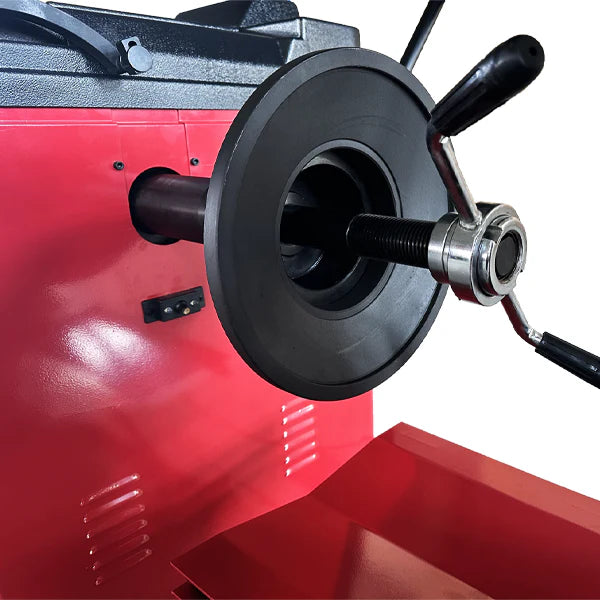 Wheel balancer turntable with black center hub and threaded axle fitting