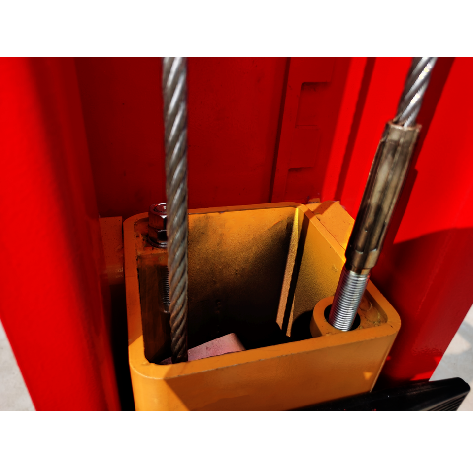 Car lift base housing with threaded guide rods and yellow mounting blocks
