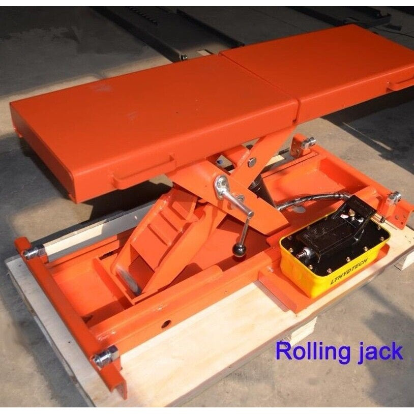Red rolling jack with yellow control housing and black hydraulic pump