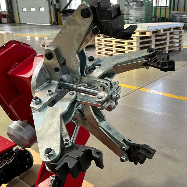 Tire changer rim clamp assembly with metal arms and adjustable mounting supports