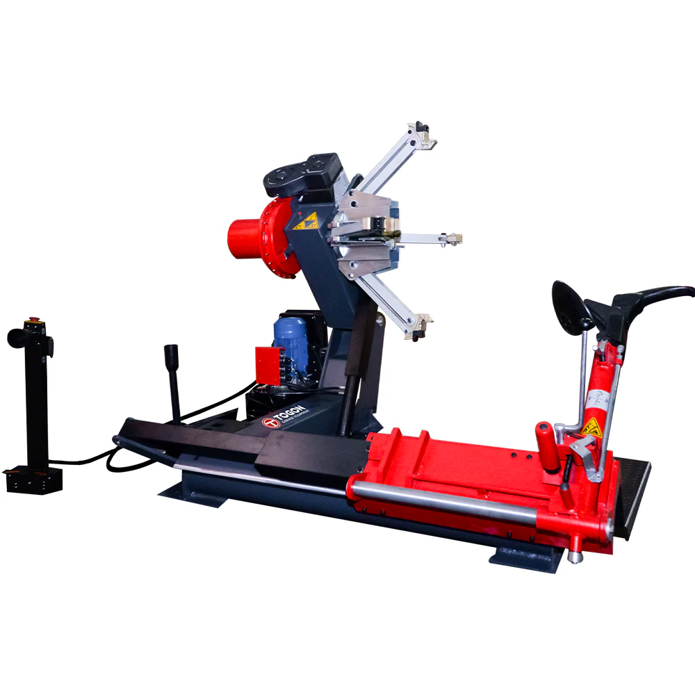 Heavy-duty truck tire changer machine with red base, black frame, and mounted clamps