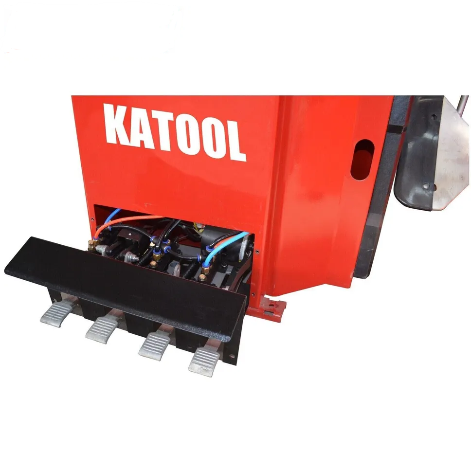 Tire changer pedal switch area and exposed internal components beneath red base