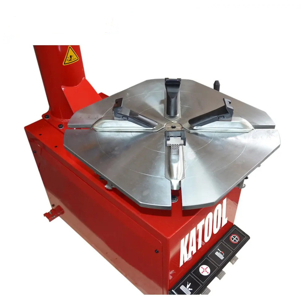 Tire changer turntable with metal mounting plate and clamp fingers