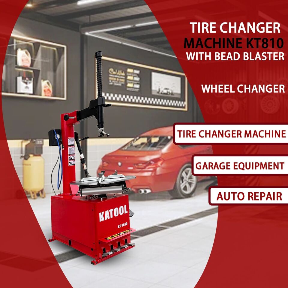Industrial tire changer machine with bead blaster arm, red and black.