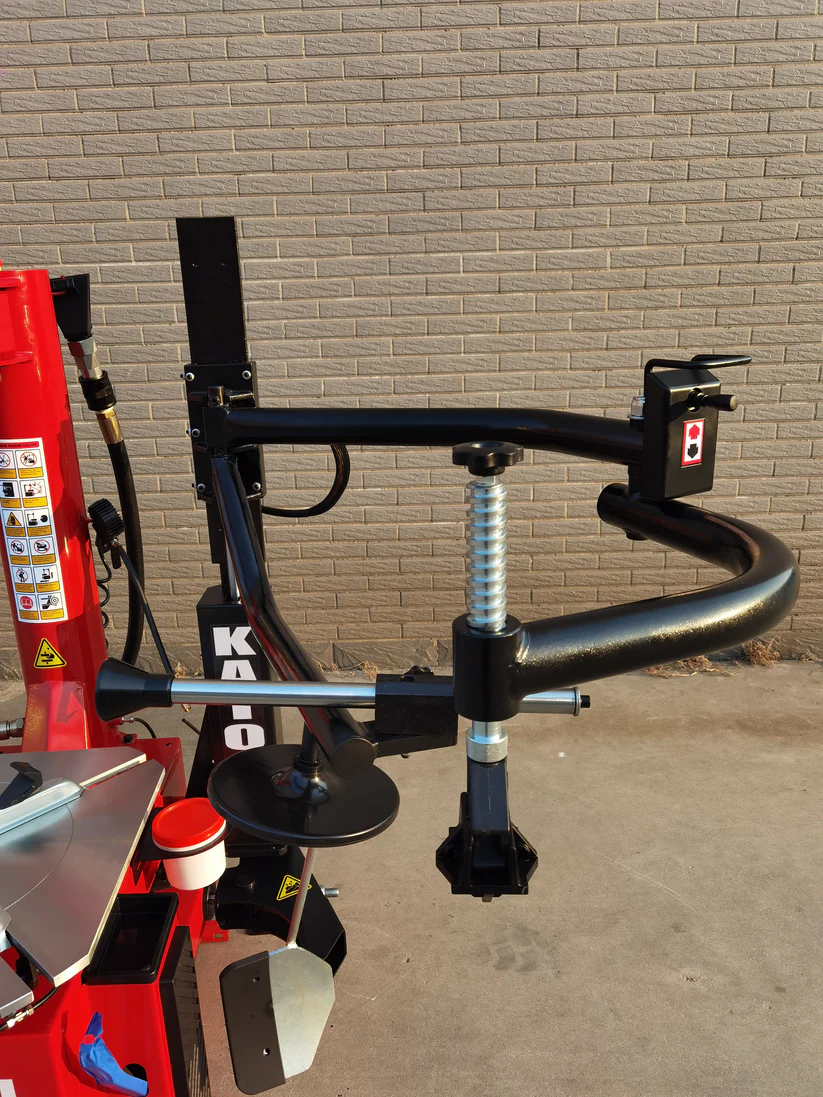 Tire changer bead blaster arms and curved black support frame