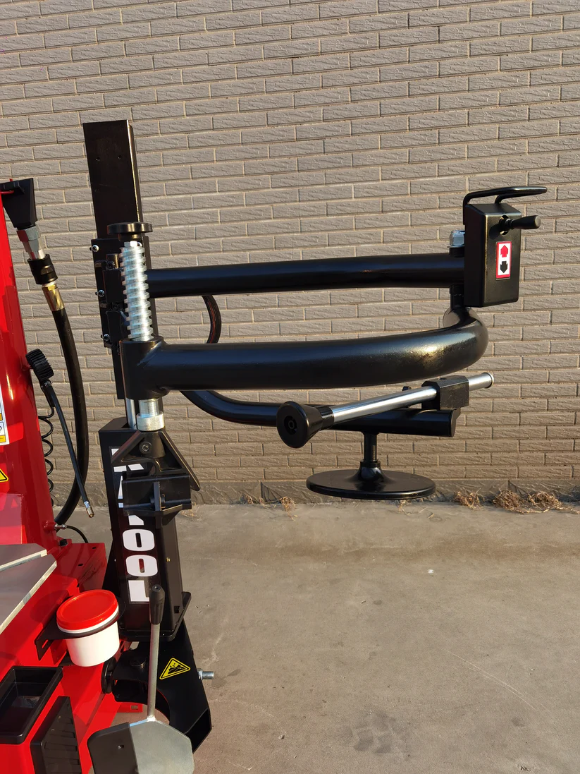 Bead blaster arm assembly with curved black pipes and mounting base