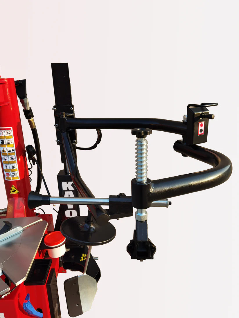 Tire changer machine with black bead tool arms and red control column