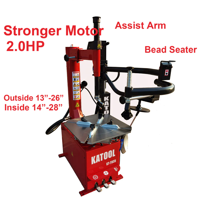 Double-arm tire changer with bead seater and assist arm, red and black, clamp arms extended