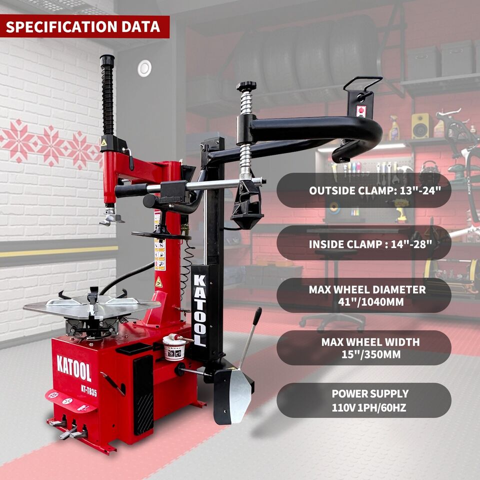 Red tire changer with black clamp bar and bead seater