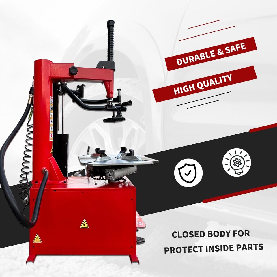 Red tire changer with black support arms and mounting head
