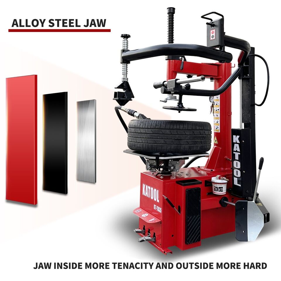 Red tire changer with steel jaw and mounted tire