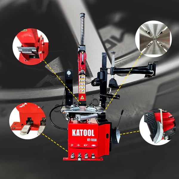 Tire changer with red base and black clamp arm for mounting and removing tires
