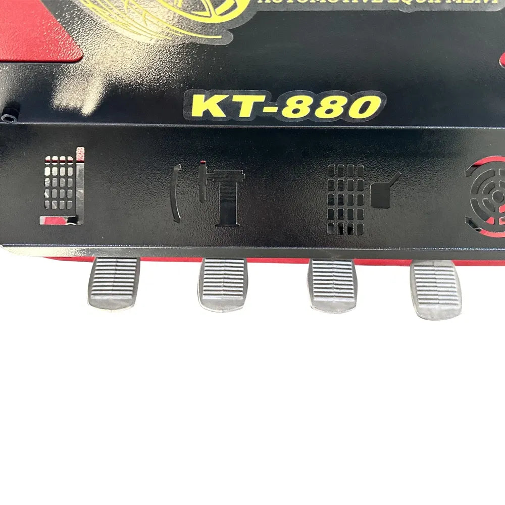 Tire changer control panel with KT-880 label and rubber pedals