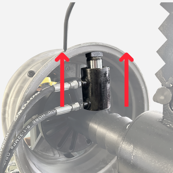 Hydraulic positioning post contacting wheel rim with connected lines