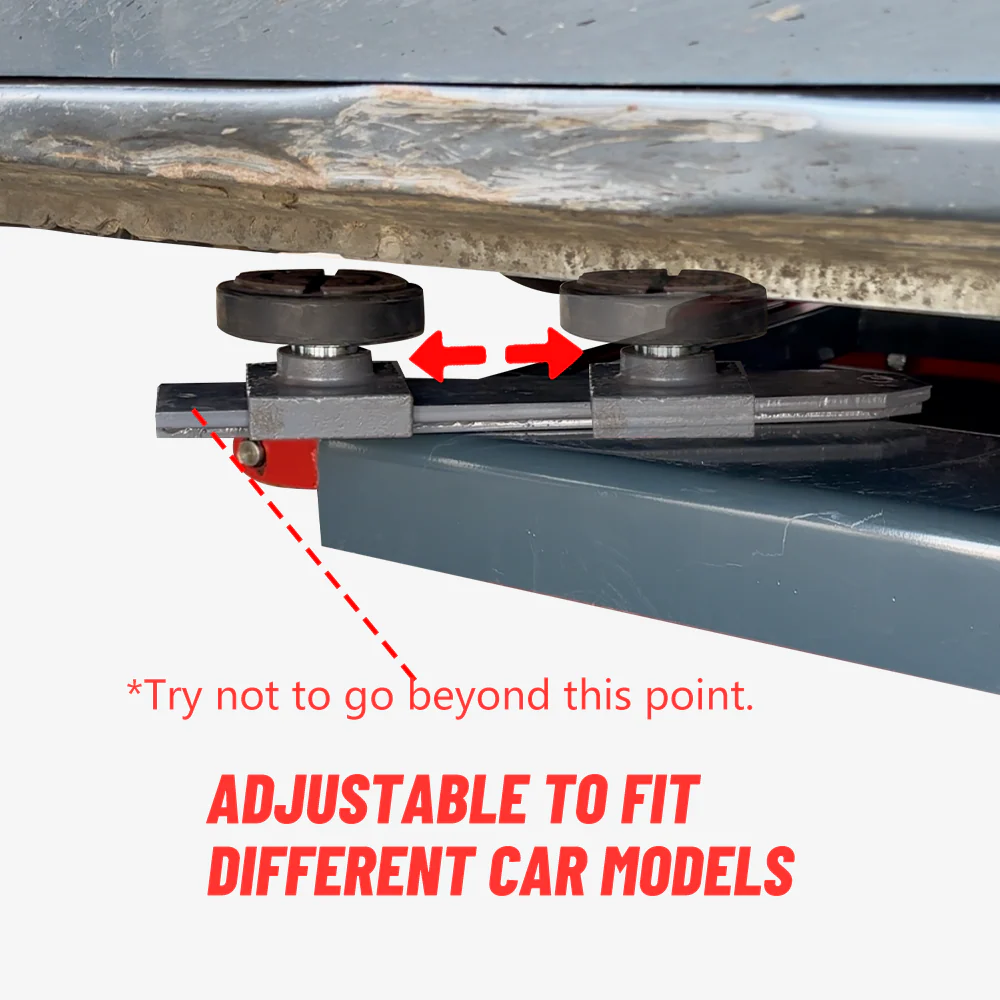 Adjustable vehicle contact rollers on a dark base beam under a lift platform