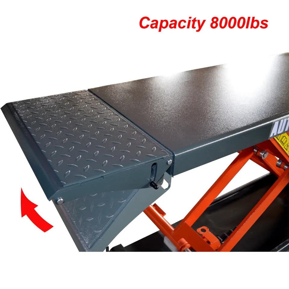 Pneumatic scissor lift platform with textured black top and orange support frame