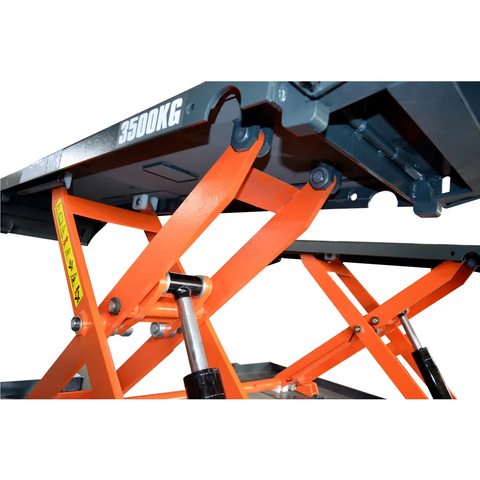 Pneumatic scissor lift scissor arms with orange steel frame and textured platform