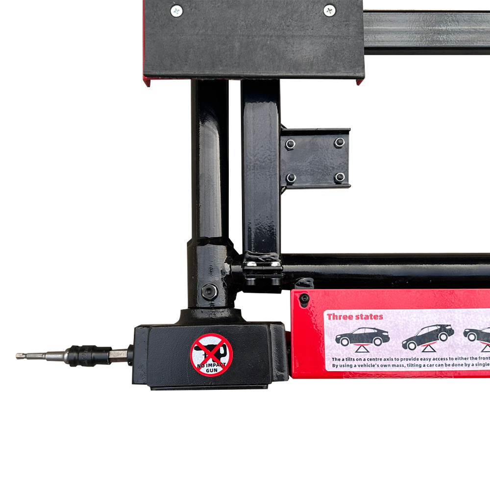 Car jack lifting head close-up with black housing and red safety warning panel
