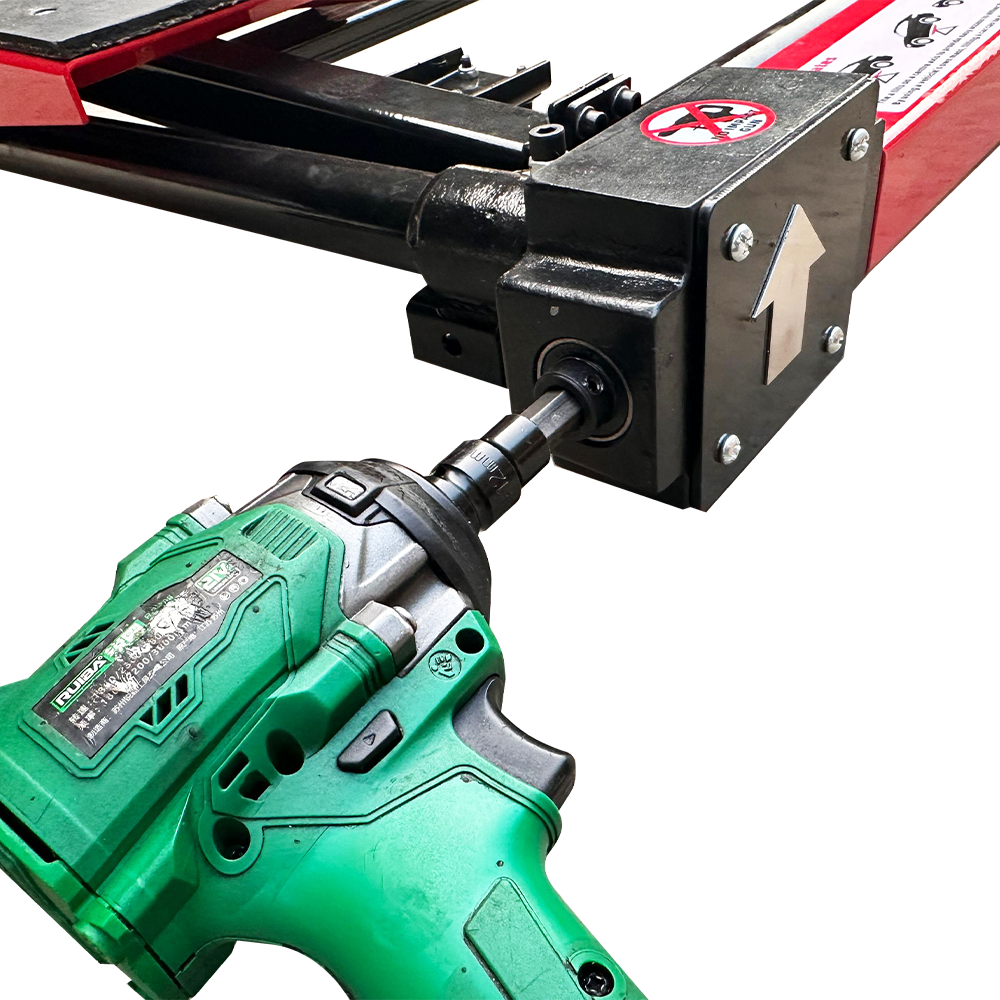 Car jack crank area close-up with cordless drill attached to the black drive housing