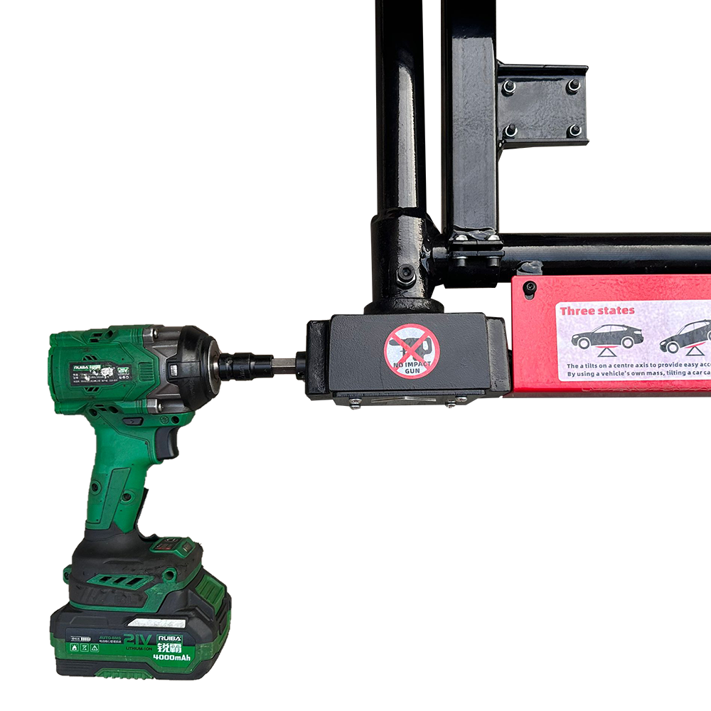 Car jack close-up being driven by a cordless drill, showing the red warning label