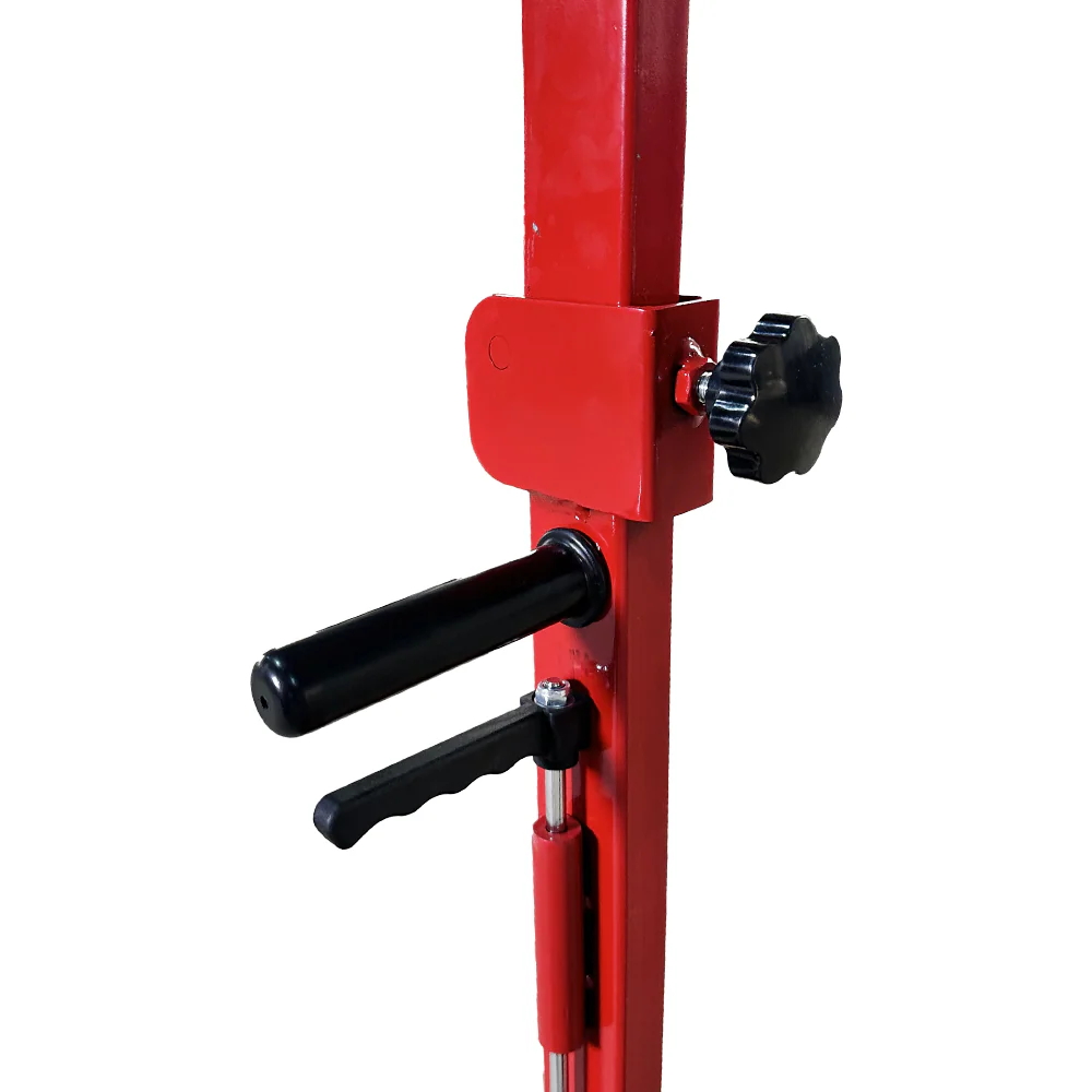Red pneumatic hydraulic jack lever and black control knob on vertical lift post