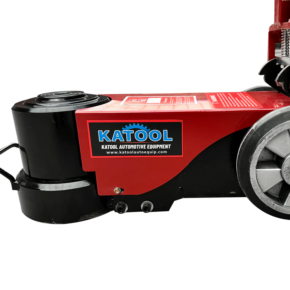 Pneumatic hydraulic jack base with red pump housing and black lifting pads