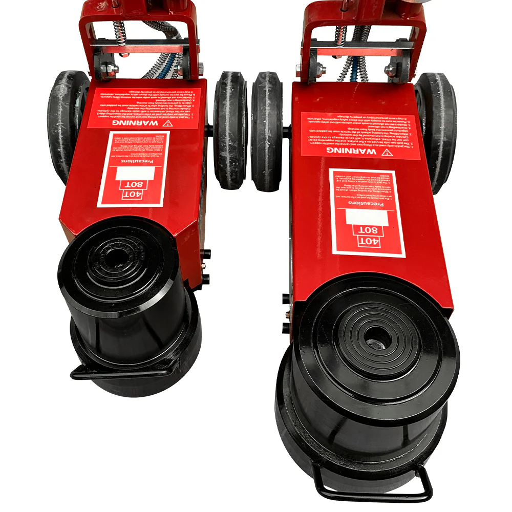 Pneumatic hydraulic jack head with dual black lifting pads and red body