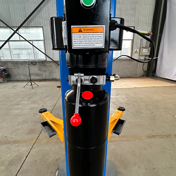 Two-post lift control column with black hydraulic unit and red emergency stop button