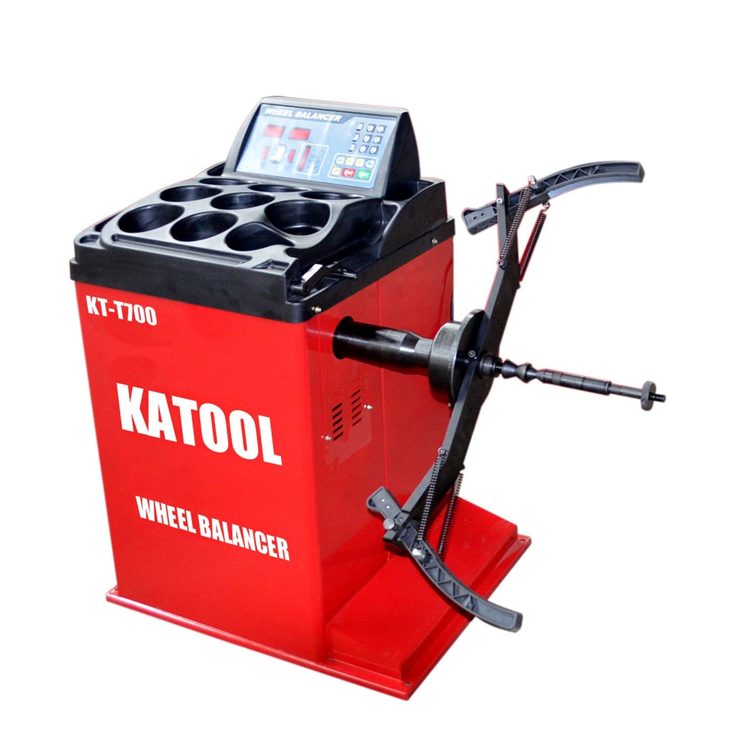 Wheel balancer accessory adaptor bracket attached to axle shaft on balancer