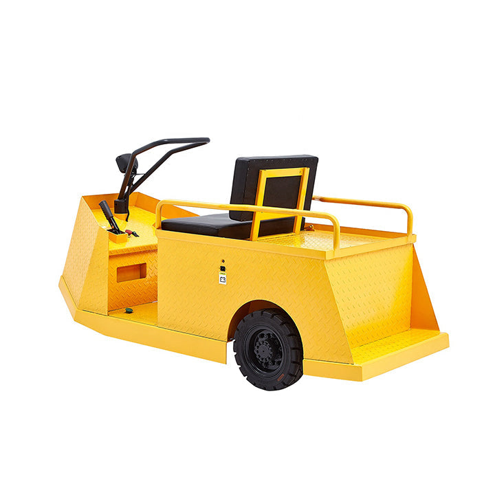 Yellow tow tractor with black seat and steering console, dual control layout