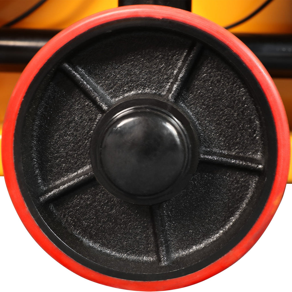 Red and black drive wheel with textured rim on a pallet jack