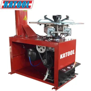 Red tire changer machine base with mounted components and support arms