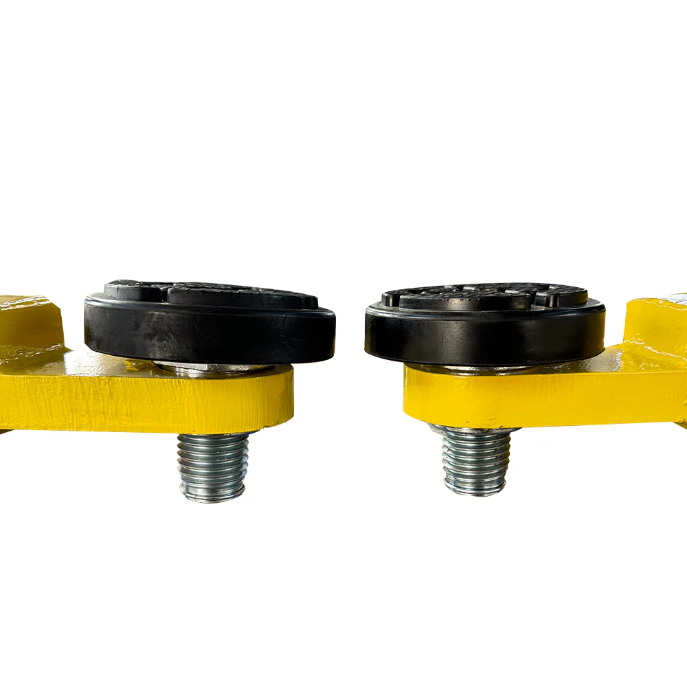 Two-post car lift arm ends with black round pads and threaded bolts on yellow base