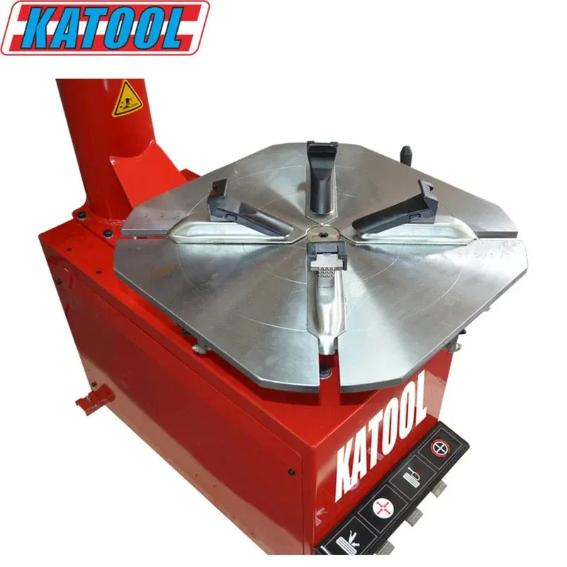 Red tire changer with large silver mounting turntable and metal mounting head