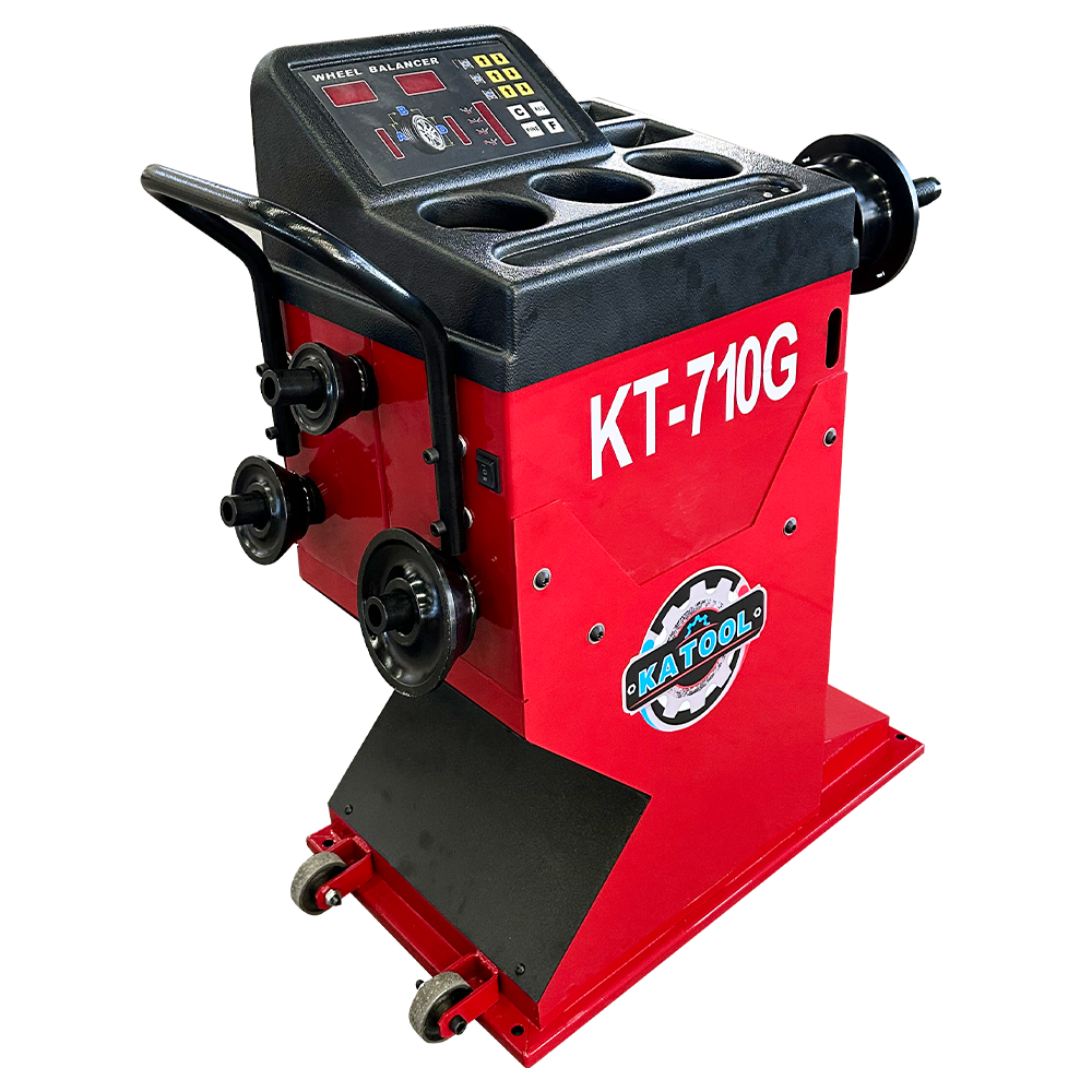 Wheel balancer machine with red body, black control console, mounting brackets, and base plate