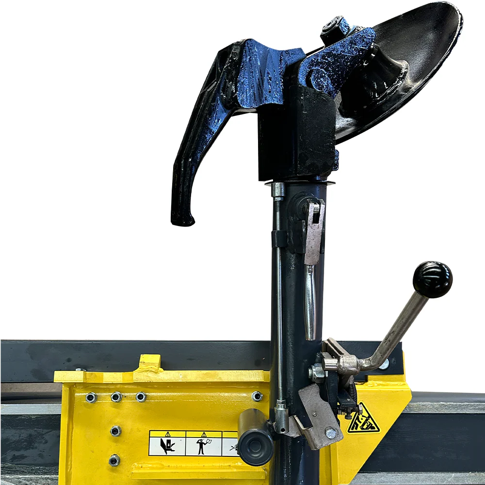 Tire mounting head and bead press tool on black vertical post with yellow base